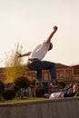 Young guys in stylish clothes ride a skateboard