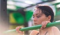 Young gymnast concentrating on her workout