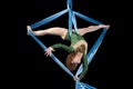 Young gymnast training on aerial silk Royalty Free Stock Photo