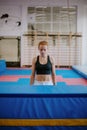 young gymnastic woman is standing in front of an obstacle and getting ready to jump Royalty Free Stock Photo