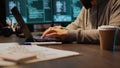 Young hacker breaking into database server on computer