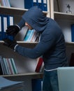 Young hacker hacking into computer at night Royalty Free Stock Photo