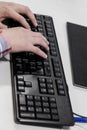 Young hacker typing code on computer keyboard Royalty Free Stock Photo