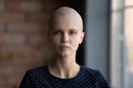 Young hairless cancer survivor head shot portrait, patient profile picture