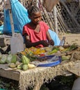 Young Haitian girl helps out at a roadside stand near Cap Haitian.