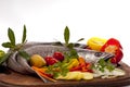 Young hake prepared for cooking with vegetables. Royalty Free Stock Photo