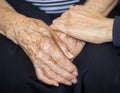 Young hand consoling old hands Royalty Free Stock Photo