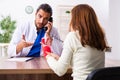 Young hand injured woman visiting male doctor traumatologist Royalty Free Stock Photo