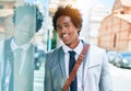Young handsome african american businessman wearing suit smiling happy Royalty Free Stock Photo