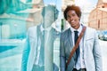 Young handsome african american businessman wearing suit smiling happy Royalty Free Stock Photo