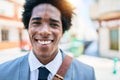 Young handsome african american businessman wearing suit smiling happy Royalty Free Stock Photo