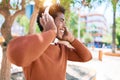 Young handsome african american man listening to music using headphones Royalty Free Stock Photo