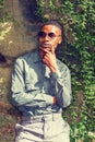 Young Handsome African American Man relaxing outside in park Royalty Free Stock Photo