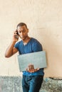 Young Handsome African American Man talking on cell phone outside in New York City Royalty Free Stock Photo