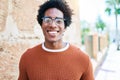 Young handsome african american man wearing casual clothes and glasses smiling happy Royalty Free Stock Photo