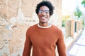 Young handsome african american man wearing casual clothes and glasses smiling happy Royalty Free Stock Photo