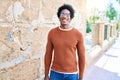 Young handsome african american man wearing casual clothes and glasses smiling happy Royalty Free Stock Photo