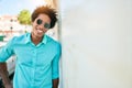 Young handsome african american man wearing casual clothes and sunglasses smiling happy Royalty Free Stock Photo