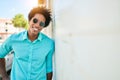 Young handsome african american man wearing casual clothes and sunglasses smiling happy Royalty Free Stock Photo