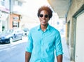 Young handsome african american man wearing casual clothes and sunglasses smiling happy Royalty Free Stock Photo