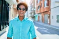 Young handsome african american man wearing casual clothes and sunglasses smiling happy Royalty Free Stock Photo