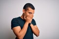 Young handsome african american man wearing casual t-shirt standing over white background with sad expression covering face with Royalty Free Stock Photo