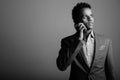 Young handsome African businessman using mobile phone Royalty Free Stock Photo