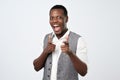 Young handsome african man with two hands guns sign gesture pointing at you camera Royalty Free Stock Photo