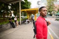 Young handsome African man waiting at the bus stop Royalty Free Stock Photo