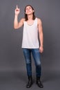 Young handsome androgynous man with long hair Royalty Free Stock Photo