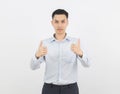 Young handsome asian business man smiling and showing thumbs up isolated on white background. Royalty Free Stock Photo