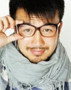 Young handsome asian man hipster in glasses on white background smiling, modern lifestyle concept close up Royalty Free Stock Photo