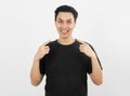 Young handsome asian man smiling with braces and looking at camera with finger pointing  on white background. Royalty Free Stock Photo