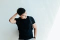 Young handsome asian men wearing casual plain black Tshirt and backpack at day in Sai Gon city, Vietnam Royalty Free Stock Photo