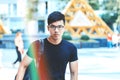 Young handsome asian men wearing casual plain shirt and backpack at day in Sai Gon city, Vietnam. Royalty Free Stock Photo