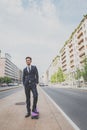 Young handsome Asian model posing with his skateboard Royalty Free Stock Photo