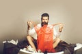 Bearded man on bath with clothes Royalty Free Stock Photo