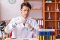 The young handsome biochemist working in the lab Royalty Free Stock Photo