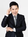 Young and handsome black hair Asian businessman in dark tone suit standing and looking to camera, pose with self-confidence and Royalty Free Stock Photo