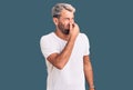 Young handsome blond man wearing casual t-shirt shouting and suffocate because painful strangle Royalty Free Stock Photo