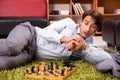 The young handsome boss playing chess during break Royalty Free Stock Photo