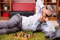 The young handsome boss playing chess during break Royalty Free Stock Photo