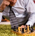 Young handsome boss playing chess during break Royalty Free Stock Photo