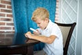 Boy holding a magnifying glass