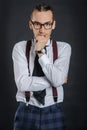 Young handsome boy in white shirt with tie and glases, clock on hand