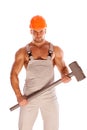 Young and handsome builder with a sledgehammer and Royalty Free Stock Photo