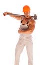 Young and handsome builder with a sledgehammer and Royalty Free Stock Photo
