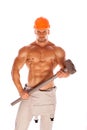 Young and handsome builder with a sledgehammer and Royalty Free Stock Photo