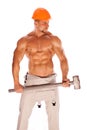 Young and handsome builder with a sledgehammer and Royalty Free Stock Photo