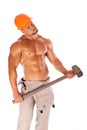 Young and handsome builder with a sledgehammer and Royalty Free Stock Photo